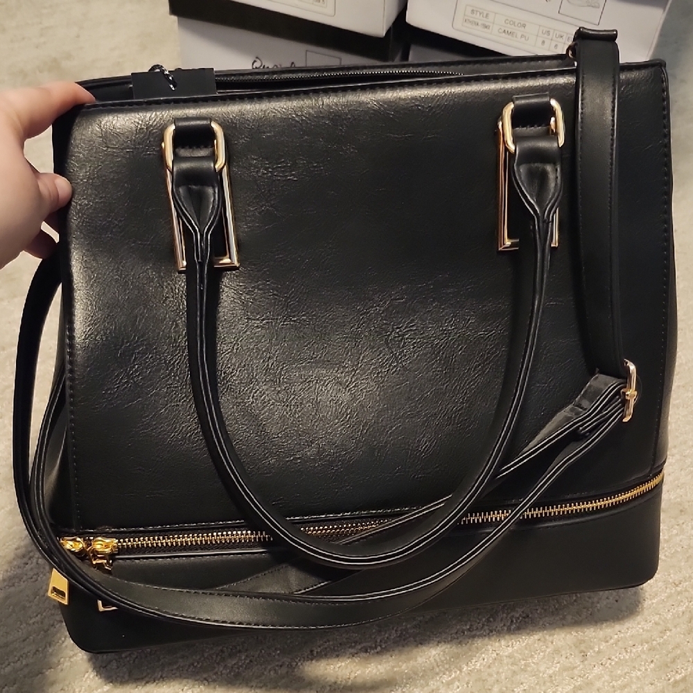 Elegant Black Handbag with Gold Accents